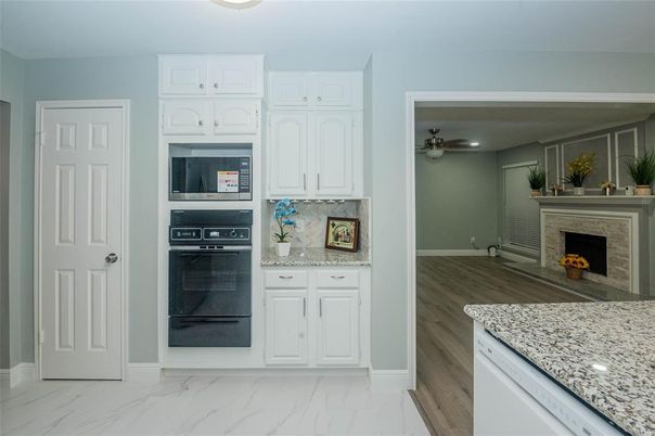 Fireplace, Interior, Kitchen, Marble, Recessed Lighting, Wood Texture Flooring