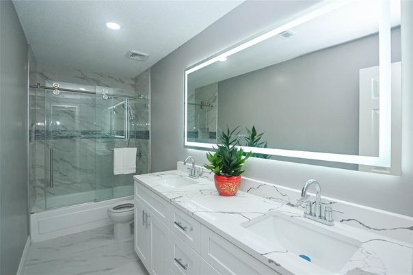 Bathroom, Dual Sink Vanities, Glass Shower, Interior, Marble, Marble Walls, Recessed Lighting