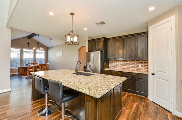 Chandelier, Dining room, Interior, Kitchen, Pendant Lights, Recessed Lighting, Stainless Steel Appliances, Wood Texture Flooring