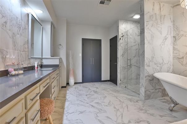 Bathroom, Dual Sink Vanities, Free Standing Baths, Interior, Marble, Marble Walls, Recessed Lighting
