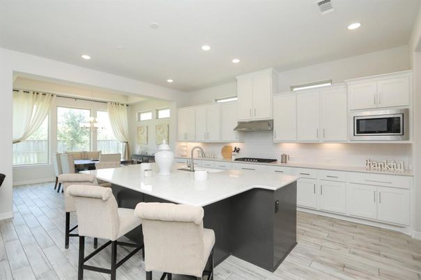 Dining room, Interior, Kitchen, Pendant Lights, Recessed Lighting, Stainless Steel Appliances, Wood Texture Flooring