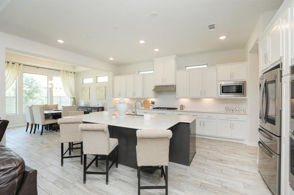 Dining room, Interior, Kitchen, Recessed Lighting, Stainless Steel Appliances, Wood Texture Flooring