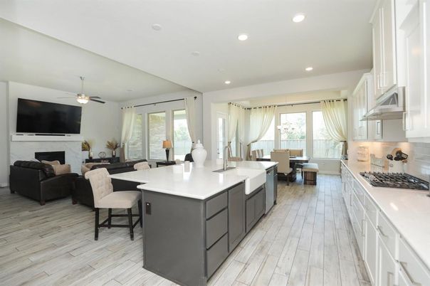 Dining room, Fireplace, Interior, Kitchen, Living room, Recessed Lighting, Wood Texture Flooring