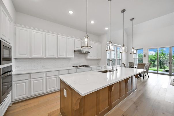Dining room, Interior, Kitchen, Pendant Lights, Recessed Lighting, Stainless Steel Appliances, Wood Texture Flooring