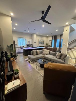 Billiard Table, Fireplace, Game Room, Interior, Living room, Pendant Lights, Recessed Lighting, Wood Texture Flooring