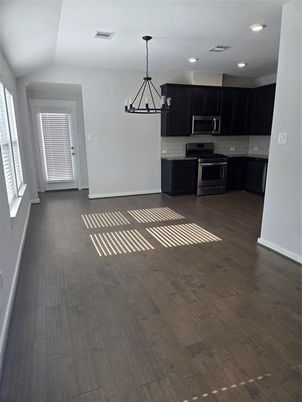 Chandelier, Interior, Kitchen, Pendant Lights, Recessed Lighting, Stainless Steel Appliances, Wood Texture Flooring