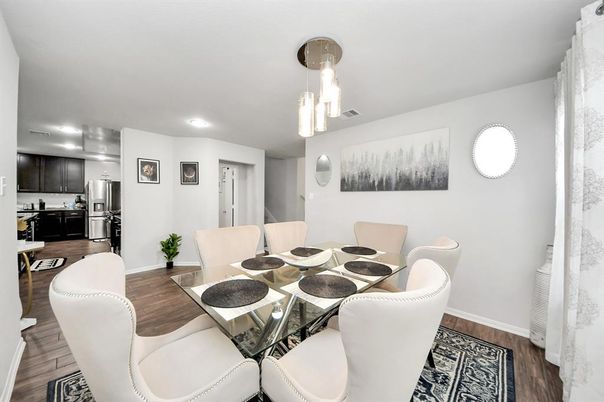 Dining room, Interior, Kitchen, Pendant Lights, Recessed Lighting, Stainless Steel Appliances, Wood Texture Flooring
