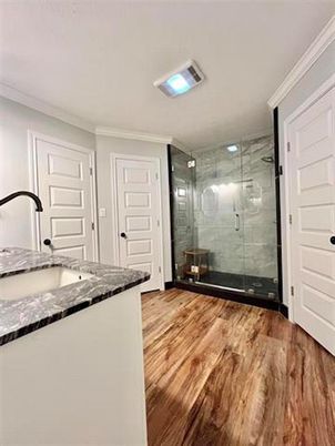 Bathroom, Glass Shower, Interior, Marble Walls, Wood Texture Flooring