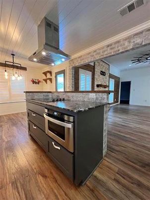 Interior, Kitchen, Pendant Lights, Stainless Steel Appliances, Stone Walls, Wood Texture Flooring