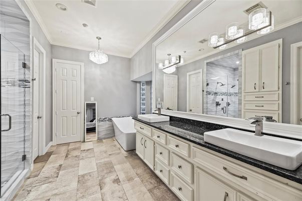 Bathroom, Chandelier, Dual Sink Vanities, Free Standing Baths, Glass Shower, Interior, Pendant Lights, Recessed Lighting