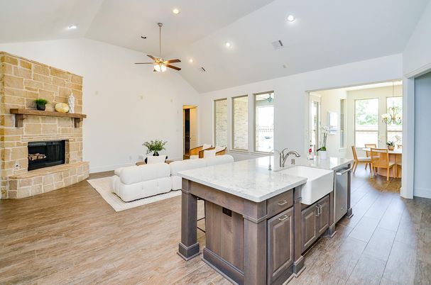 Dining room, Fireplace, Interior, Kitchen, Living room, Recessed Lighting, Stone Walls, Wood Texture Flooring