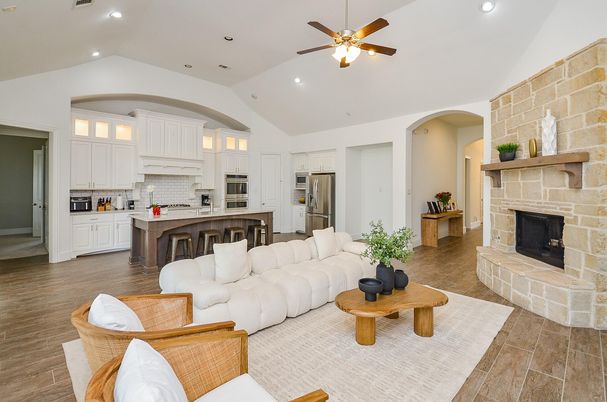 Fireplace, Interior, Kitchen, Living room, Recessed Lighting, Stainless Steel Appliances, Stone Walls, Wood Texture Flooring