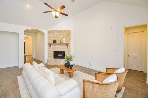 Fireplace, Interior, Living room, Recessed Lighting, Stone Walls, Wood Texture Flooring