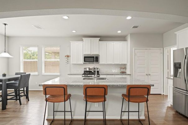 Dining room, Interior, Kitchen, Pendant Lights, Recessed Lighting, Stainless Steel Appliances, Wood Texture Flooring