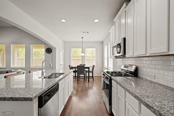 Dining room, Interior, Kitchen, Pendant Lights, Recessed Lighting, Stainless Steel Appliances, Wood Texture Flooring