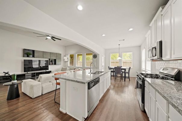 Dining room, Interior, Kitchen, Living room, Pendant Lights, Recessed Lighting, Stainless Steel Appliances, Wood Texture Flooring