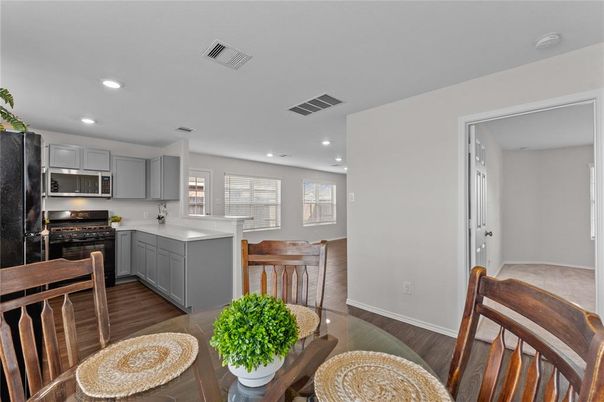 Dining room, Interior, Kitchen, Recessed Lighting, Stainless Steel Appliances, Wood Texture Flooring