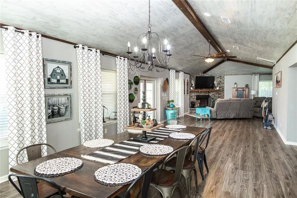 Chandelier, Dining room, Fireplace, Interior, Living room, Stone Walls, Wooden Beams, Wood Texture Flooring