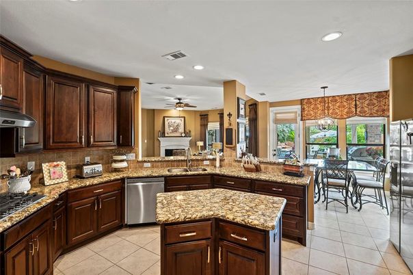 Dining room, Fireplace, Interior, Kitchen, Recessed Lighting, Stainless Steel Appliances