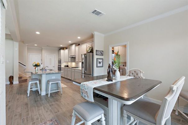 Dining room, Interior, Kitchen, Recessed Lighting, Stainless Steel Appliances, Wood Texture Flooring