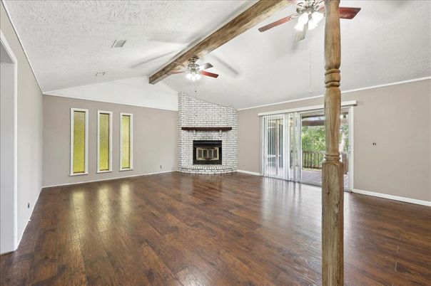 Empty room, Fireplace, Interior, Stone Walls, Wooden Beams, Wood Texture Flooring
