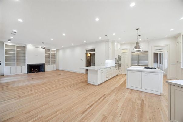 Empty room, Fireplace, Interior, Kitchen, Pendant Lights, Recessed Lighting, Wood Texture Flooring