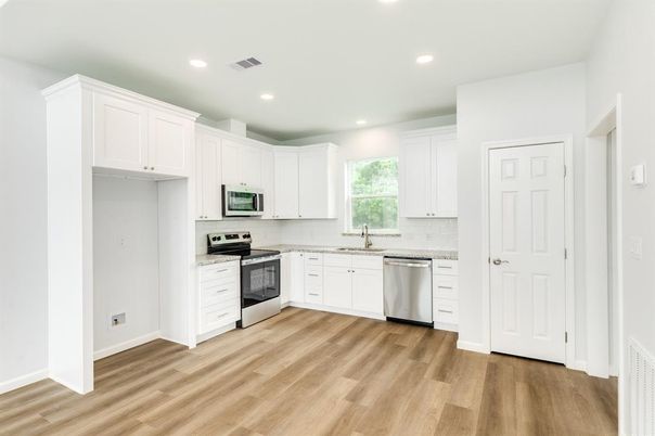Interior, Kitchen, Recessed Lighting, Stainless Steel Appliances, Wood Texture Flooring