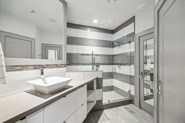 Bathroom, Dual Sink Vanities, Glass Shower, Interior, Recessed Lighting, Wood Texture Flooring