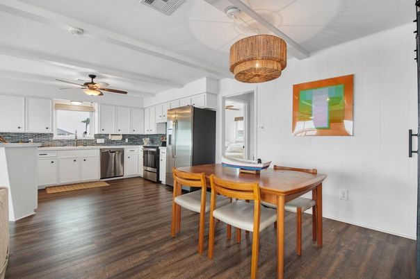 Chandelier, Dining room, Interior, Kitchen, Stainless Steel Appliances, Wood Texture Flooring