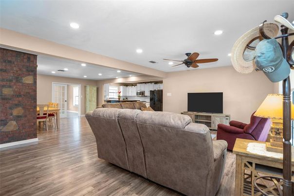 Dining room, Fireplace, Interior, Kitchen, Living room, Recessed Lighting, Stone Walls, Wood Texture Flooring