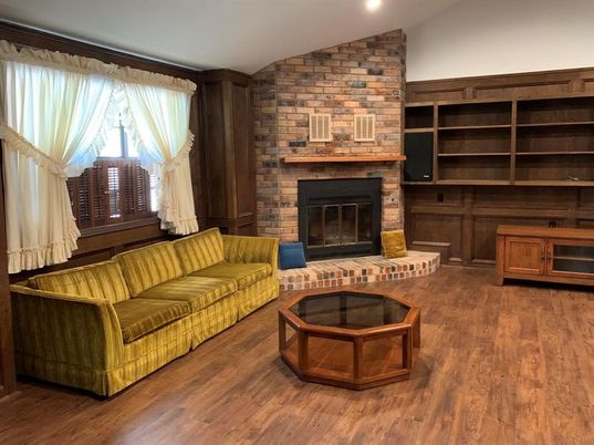 Fireplace, Interior, Living room, Recessed Lighting, Stone Walls, Wood Texture Flooring