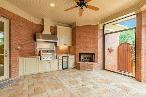 Fireplace, Interior, Kitchen, Recessed Lighting, Stainless Steel Appliances, Stone Walls