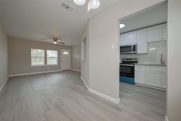 Empty room, Interior, Kitchen, Stainless Steel Appliances, Wood Texture Flooring