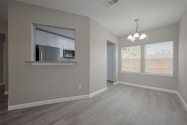 Chandelier, Empty room, Interior, Kitchen, Pendant Lights, Stainless Steel Appliances, Wood Texture Flooring