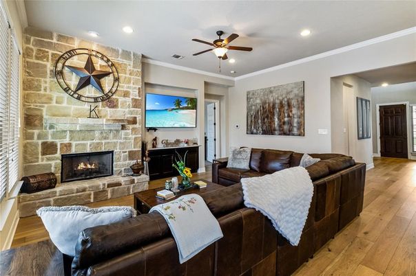 Fireplace, Interior, Living room, Recessed Lighting, Stone Walls, Wood Texture Flooring