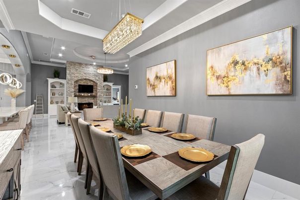 Chandelier, Dining room, Fireplace, Interior, Living room, Marble, Pendant Lights, Recessed Lighting, Stone Walls