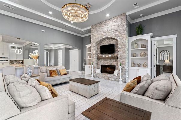 Chandelier, Fireplace, Interior, Living room, Recessed Lighting, Stone Walls, Wood Texture Flooring