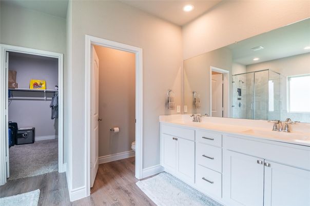 Bathroom, Dual Sink Vanities, Glass Shower, Interior, Recessed Lighting, Wood Texture Flooring