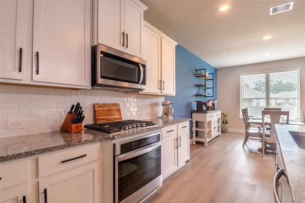 Dining room, Interior, Kitchen, Recessed Lighting, Stainless Steel Appliances, Wood Texture Flooring