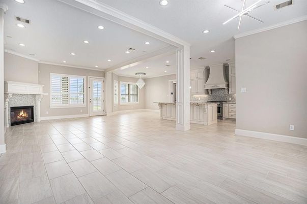 Empty room, Fireplace, Interior, Kitchen, Recessed Lighting, Wood Texture Flooring