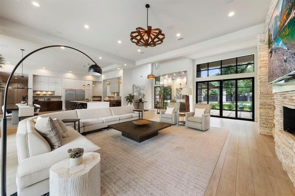Fireplace, Interior, Kitchen, Living room, Pendant Lights, Recessed Lighting, Stainless Steel Appliances, Stone Walls, Wood Texture Flooring