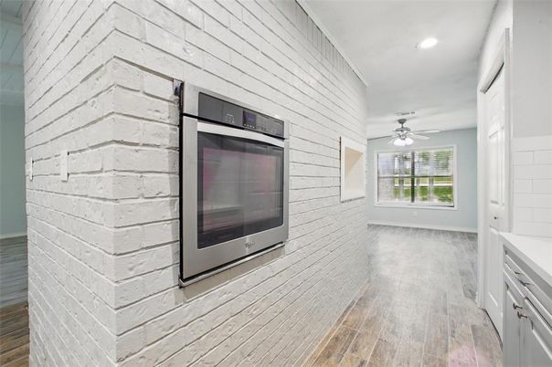 Interior, Kitchen, Recessed Lighting, Stainless Steel Appliances, Stone Walls, Wood Texture Flooring