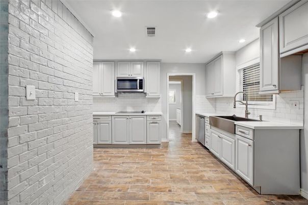 Interior, Kitchen, Recessed Lighting, Stainless Steel Appliances, Stone Walls, Wood Texture Flooring