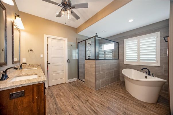 Bathroom, Dual Sink Vanities, Free Standing Baths, Glass Shower, Interior, Recessed Lighting, Wood Texture Flooring
