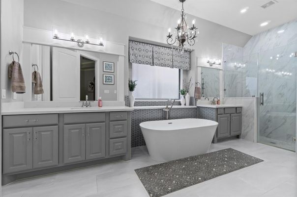 Bathroom, Chandelier, Dual Sink Vanities, Free Standing Baths, Glass Shower, Interior, Marble Walls, Recessed Lighting