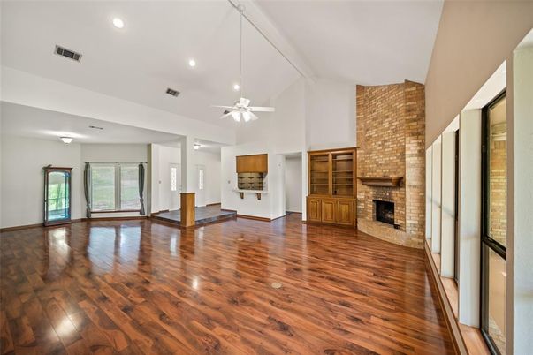 Empty room, Fireplace, Interior, Recessed Lighting, Stone Walls, Wood Texture Flooring