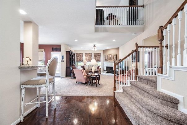Dining room, Fireplace, Interior, Living room, Recessed Lighting, Wood Texture Flooring