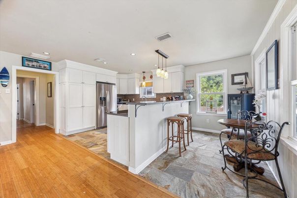 Dining room, Interior, Kitchen, Pendant Lights, Recessed Lighting, Stainless Steel Appliances, Wood Texture Flooring