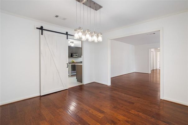 Empty room, Interior, Kitchen, Pendant Lights, Stainless Steel Appliances, Wood Texture Flooring