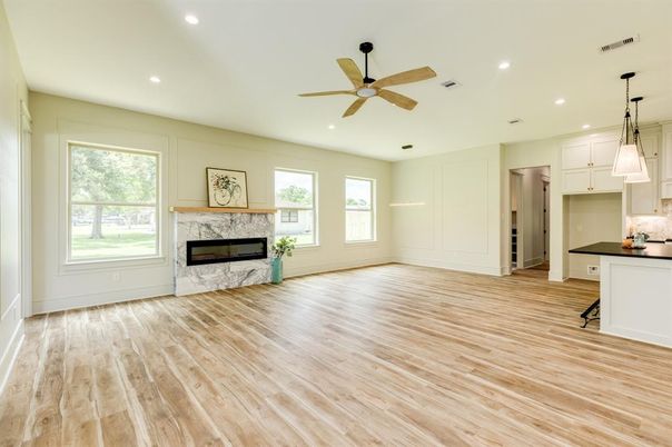 Empty room, Fireplace, Interior, Kitchen, Pendant Lights, Recessed Lighting, Wood Texture Flooring
